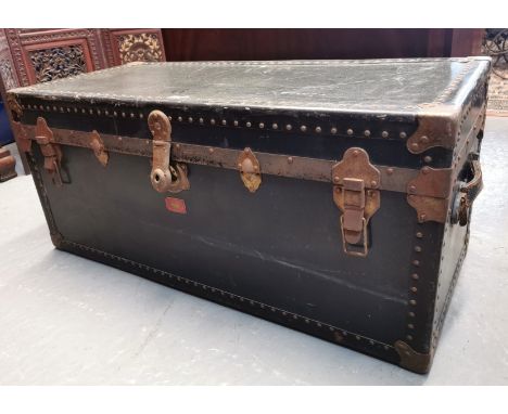 Early 20th century canvas and metal banded steamer trunk, the interior revealing two lift out trays with compartments. (B.P. 