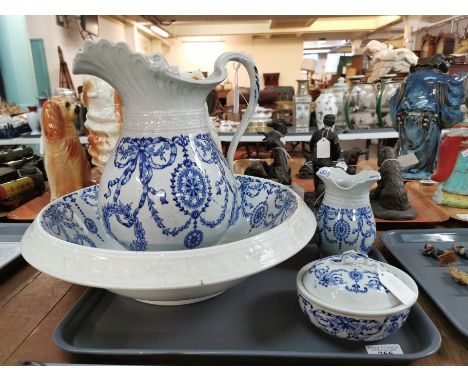 Early 20th century Staffordshire blue and white jug and basin set with matching toothbrush holder and soap dish and cover, de