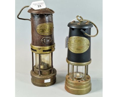 E Thomas and Williams of Aberdare Miner's safety lamp. 27cm high approx. Together with another unused British Coal Mining Com