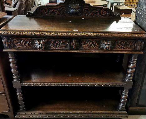 Victorian oak three tier buffet, ornately carved with two drawers and mask heads, on barley twist supports. 120x46x107cm appr