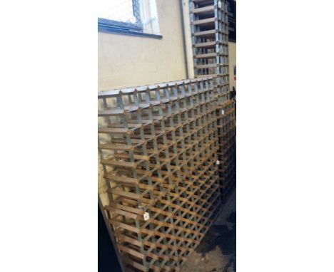 A collection of vintage wooden and metal wine racks. (4) (B.P. 21% + VAT)