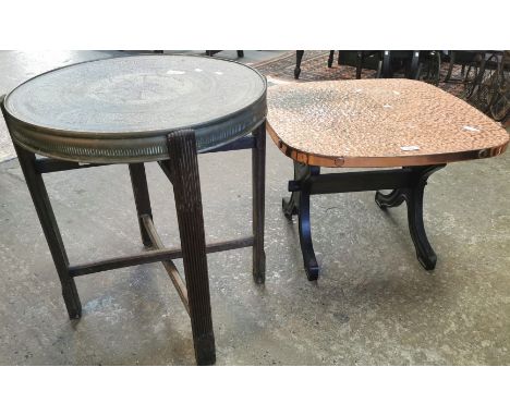 An Indian brass tray top folding table together with a beaten copper side or lamp table. (2) (B.P. 21% + VAT)