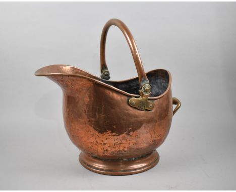 A Late 19th/Early 20th Century Heavy Copper Helmet Shaped Coal Scuttle, 42cms Long 