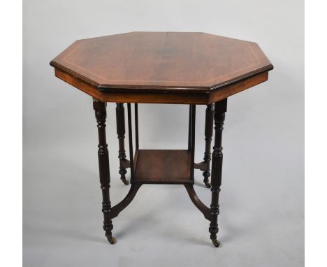 An Edwardian String inlaid Walnut and Mahogany Octagonal Occasional Table with Stretcher Shelf, 78cms Diameter 