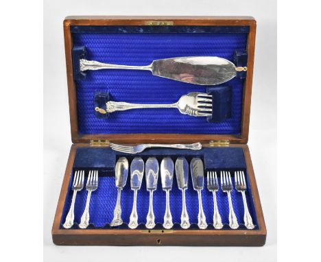 An Edwardian Oak Canteen containing Fish Knives, Forks and Servers, One Fork Replacement 