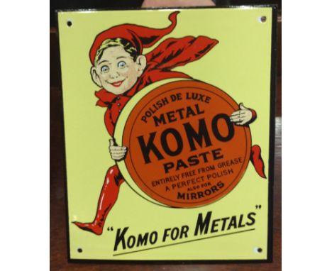 ENAMEL ADVERTISEMENT'Komo paste', metal polish sign, central design with imp holding paste tin 'Komo for Metals'