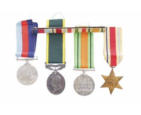 GEORGE VI TERRITORIAL ARMY EFFICIENT SERVICE MEDALnamed for '915681 Cpl A.F. Fair R.E.M.E'; together with three WWII campaign