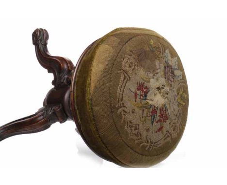 VICTORIAN WALNUT CIRCULAR REVOLVING PIANO STOOLwith needlework top, on moulded tripod legs, 36cm diameter