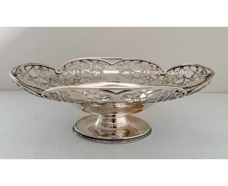 A George VI silver oval basket with elaborate pierced decoration on a raised base by Harrison Brothers &amp; Howson, Sheffiel