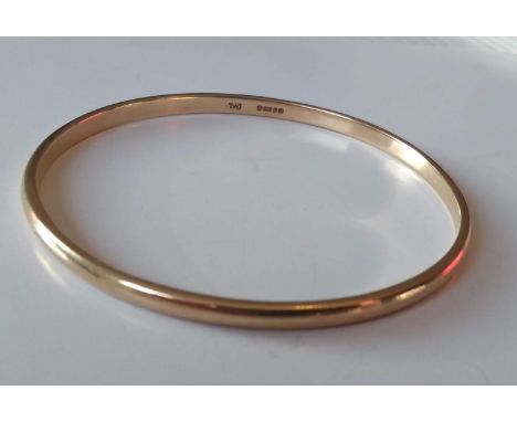 A 9ct yellow gold bangle, hallmarked, 65mm diameter, 16.73g 
