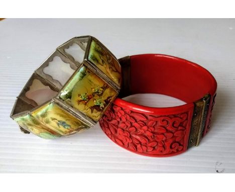 A vintage Chinese red cinnabar bangle with carved decoration and ornate brass clasp and an octagonal bracelet with painted Ch