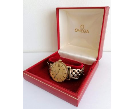 An early 1960s Omega Automatic De Ville wristwatch with champagne dial, baton markers, central seconds sweep, date aperture, 