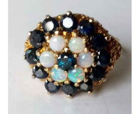 An opal and sapphire cluster dress ring on a 9ct gold setting, size T, hallmarked, 7.35g 