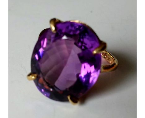 A 9ct yellow gold amethyst dress ring in a double bezel coronet, 18.49 x 15.02 x 9.59mm, 16.33 carat, hallmarked, size N, 6.7