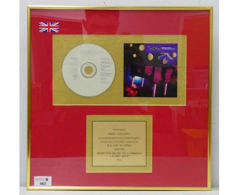 The Orb, gold disc sales award to Anne Docherty, for 100,000 sales of 'Adventures Beyond The Ultraworld' album, 1991