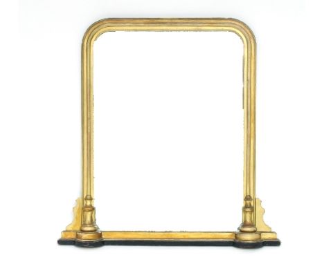 A giltwood overmantel mirror, with arched top, moulded surround with half turned columns to either side at base, 113cm x 85cm