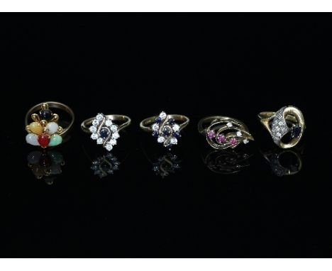 A multi-gem set ring, set in 14k gold, the pear shaped stones modelled as a bunch of berries, ring size P½ and four other gem