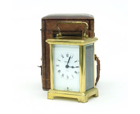 A gilt brass eight-day carriage clock in a leather case Condition Report: This is a modern clock in an older case in intermit