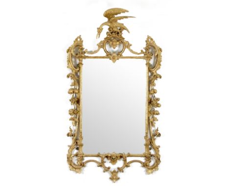 An 18th Century carved giltwood mirror with scroll and floral carved surround and ho-ho bird surmount, approximately 150cm hi