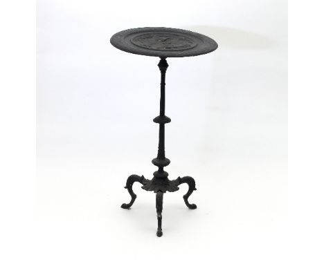 A circular cast iron garden table, the top cast with a Classical scene, on tripod base, 44cm wide