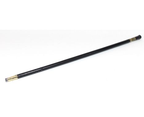 An ebonised sword stick, with brass finial and collar, 92cm long