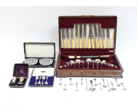 A canteen of plated flatware, a quantity of souvenir spoons, two sterling silver mate spoons etc.