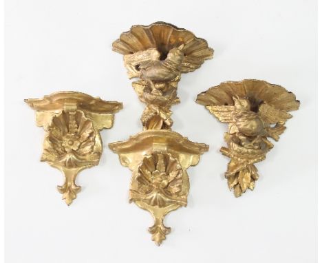 Two pairs of carved and gilded wall brackets supported by birds and shells, 20cm and 19cm high Condition Report: Two shell mo