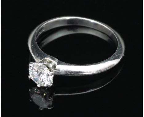 A Tiffany & Co. diamond solitaire ring set in platinum, the shank marked D37323, .64ct, ring size M/see illustration