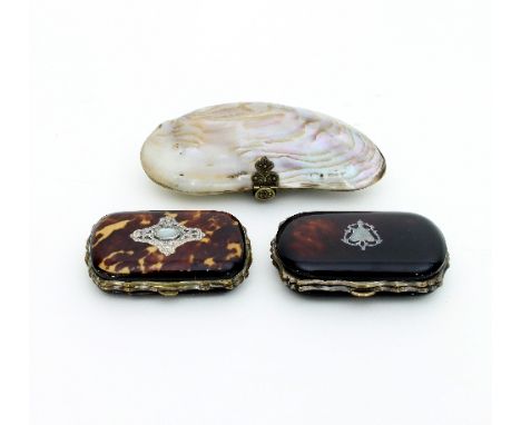 A 19th Century oyster-shell purse, 12cm wide and two tortoiseshell cased purses, one with inset silver cartouche to the cover