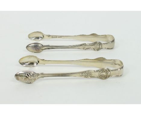 A pair of Irish silver Queens pattern sugar tongs, J Smyth, Dublin 1850, another pair retailed by M West, Dublin 1814 and an 