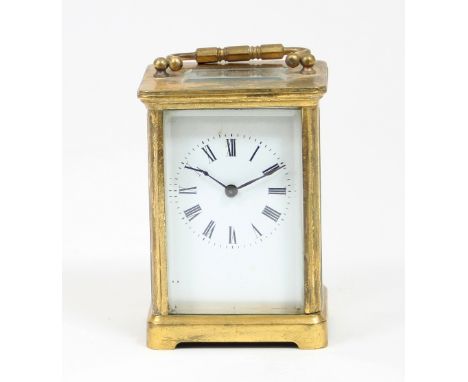 A gilt brass cased carriage clock, the white enamel dial with Roman numerals, 10.5cm high
