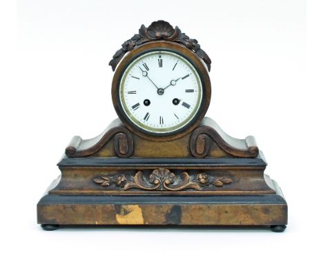A Victorian eight-day mantel clock, in a walnut case with foliate carving, 32cm wide