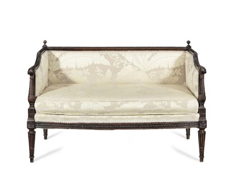 A small late 19th/early 20th century mahogany sofa or 'love seat'in the Louis XVI styleWith beaded and lotus-leaf moulded top