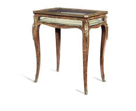 A French late 19th/early 20th century gilt bronze mounted rosewood bijouterie tableWith scrolled foliate chute mounts and bev