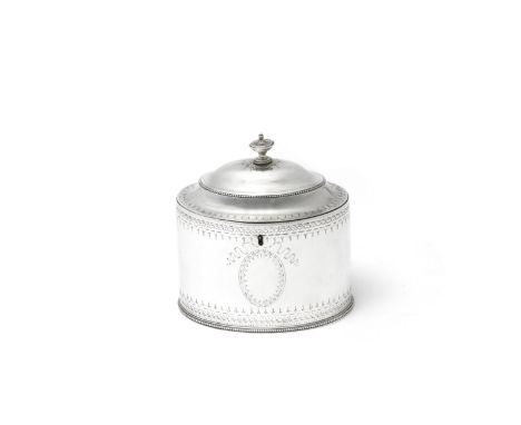 A George III silver tea caddyHester Bateman, London 1786 Oval form, with bright-cut engraved decoration, length 13cm, weight 