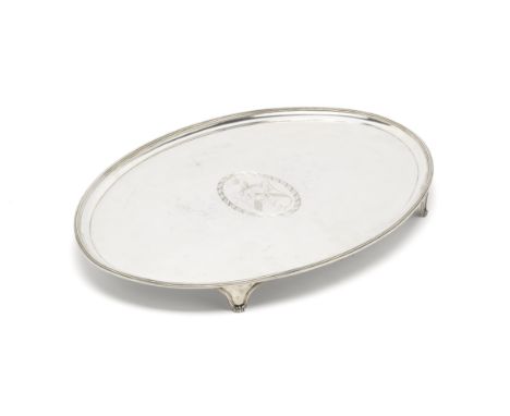 A  George III silver trayJohn Crouch I &amp; Thomas Hannam, London 1792Oval, with a raised reeded rim, on four tapering brack