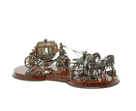 A remarkable parcel-gilt and enamelled silver model of a horse drawn carriageseemingly unmarked Modelled as a four-horse carr