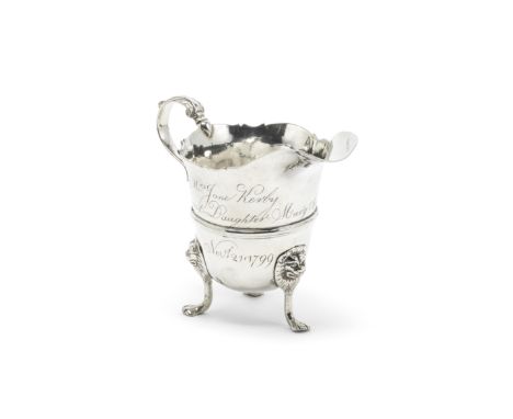 A mid-18th century Irish provincial silver cream jugGeorge Hodder, Cork circa 1760 Helmet form, with a scroll handle and thre