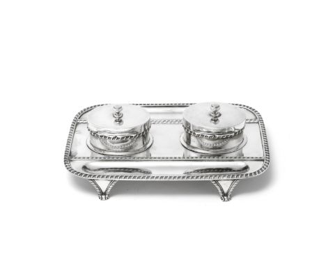 A Victorian silver inkstandBarnards, London 1897 Rounded rectangular form with gadroon borders, with two oval lidded ink well