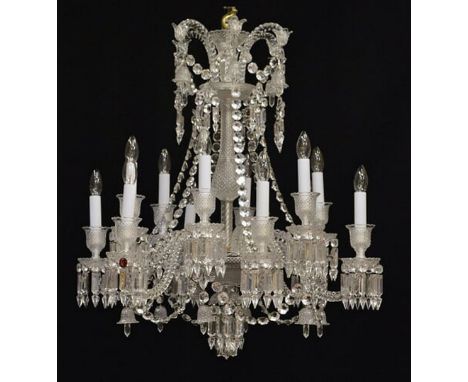 A Baccarat cut and moulded clear glass twelve light Zenith chandelierthe spiral scrolling arms supporting diamond cut nozzles