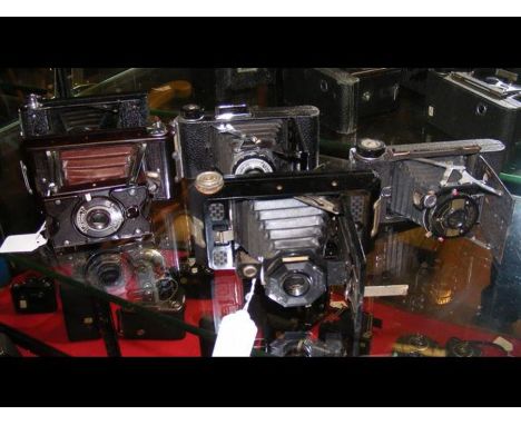 Five vintage folding cameras including Soho Pilot and Penguin