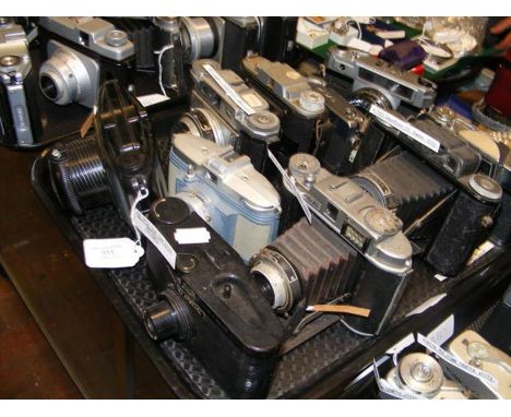 A tray of vintage cameras including Konica