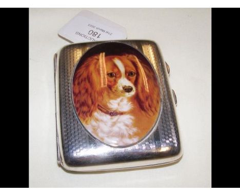 A silver and enamel cigarette case depicting a Spaniel 