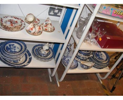 Four shelves of ceramic and glassware