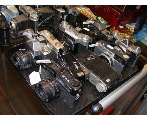 A tray of vintage cameras including Zenit