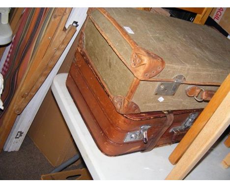 A vintage leather suitcase with Cunard Line label, together with one other suitcase 
