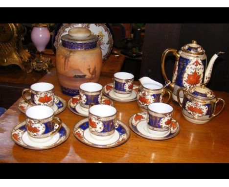 A Noritake coffee service together with a Noritake lidded vase with Egyptian sceneCONDITION REPORTIn our judgement, condition