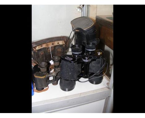 A pair of vintage German binoculars together with a pair of Boots binoculars