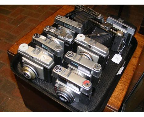 A tray of vintage cameras including two folding cameras