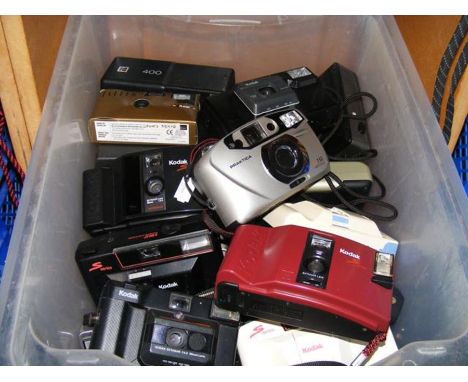 A box of vintage cameras, including Kodak and Praktica 